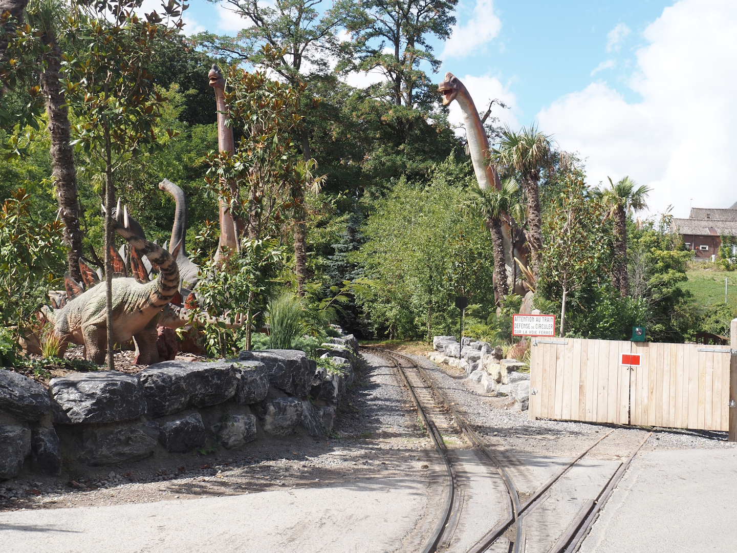 Prehi Daiza: Lands of the Past - Land of the Giants - Area with dinosaur animatronic models surrounding train track, 2025-09-01