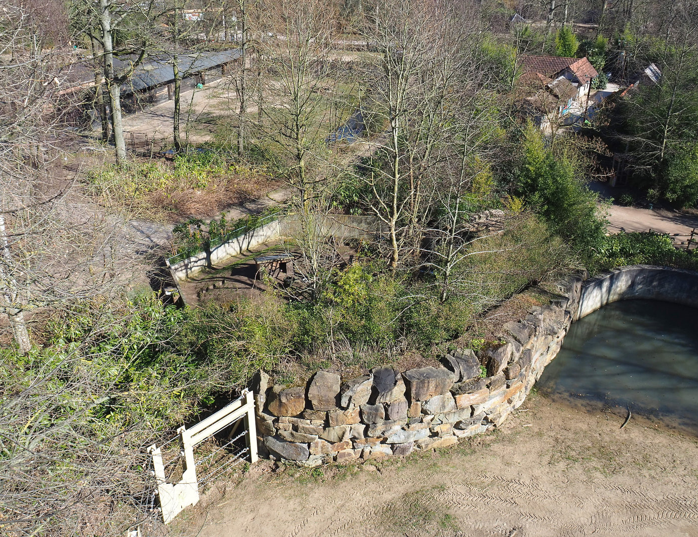 Red panda exhibit, fencing of Asian elephant exhibit, part of Bactrian camel paddock and Indian village seen from the tree-top walk, 2022-03-08
