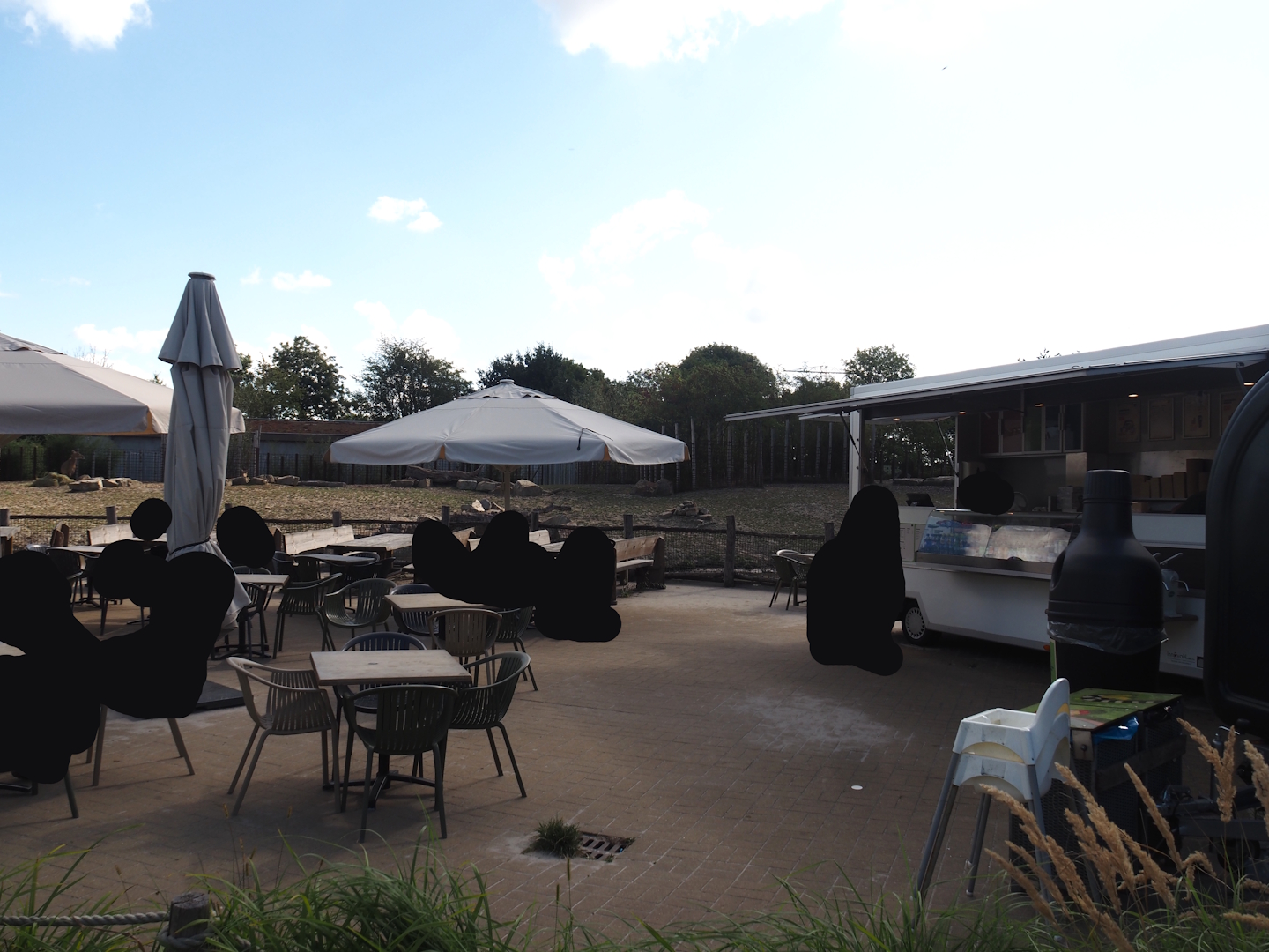 Rest area between Amur tiger and Indian rhinoceros exhibits - Terrace and food truck next to rhinos, 2025-08-24