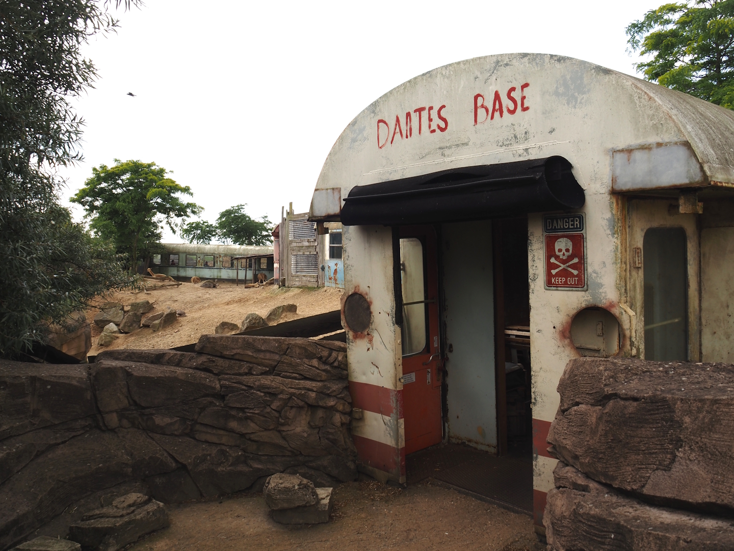 Serenga - Entrance to derailed train viewing area with poachers' hide-out theming, 2024-06-23