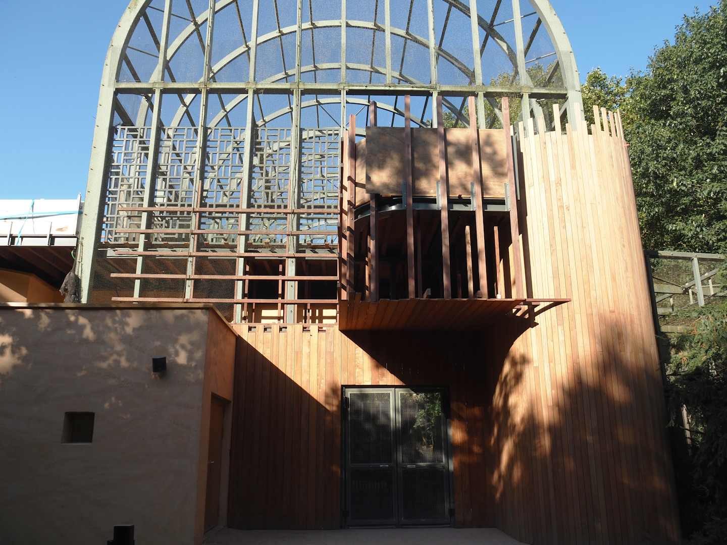 Side of the hippo house aviary, with new upper viewing area under construction now partially opened, 2024-08-28