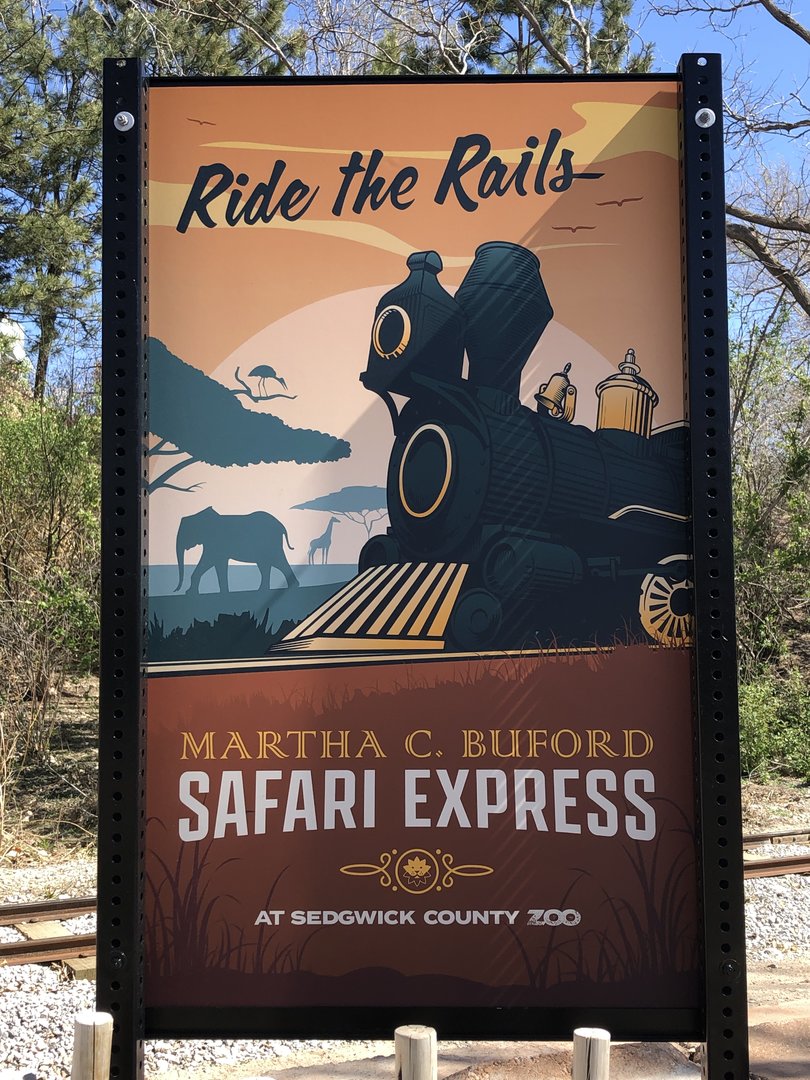 Sign advertising the new train ride at the zoo