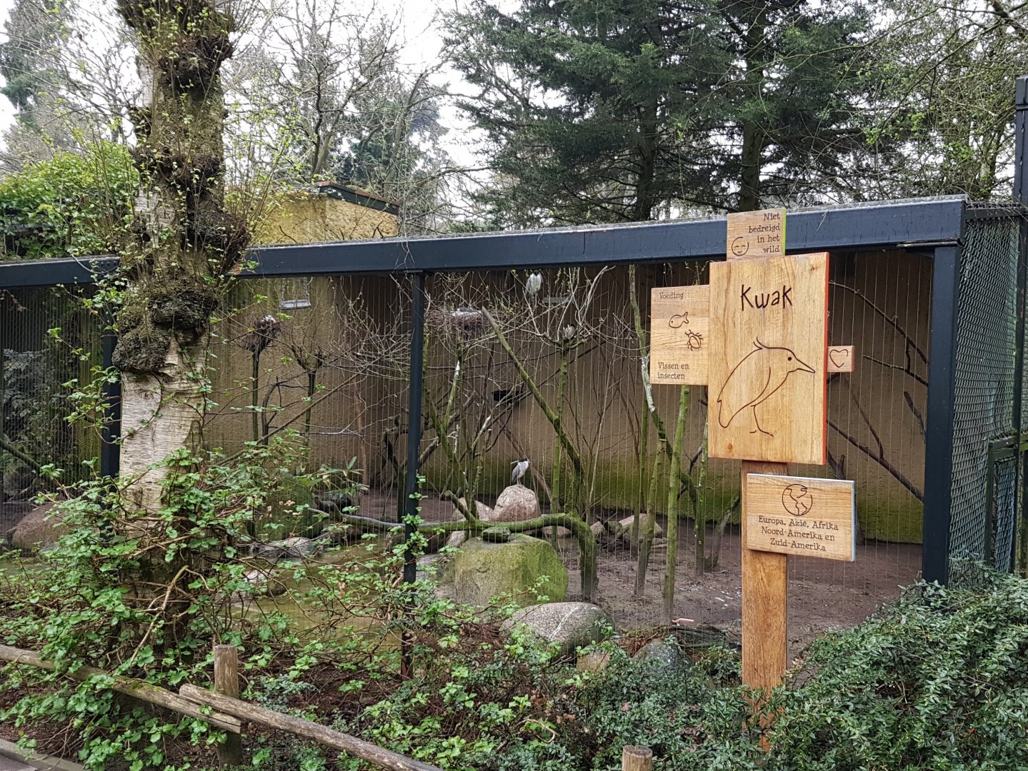 Sign and aviary Night heron