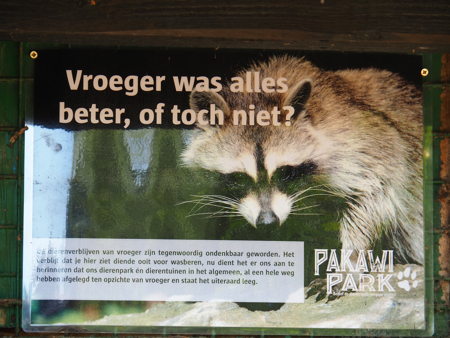 Sign on old raccoon cage, 2019-08-11