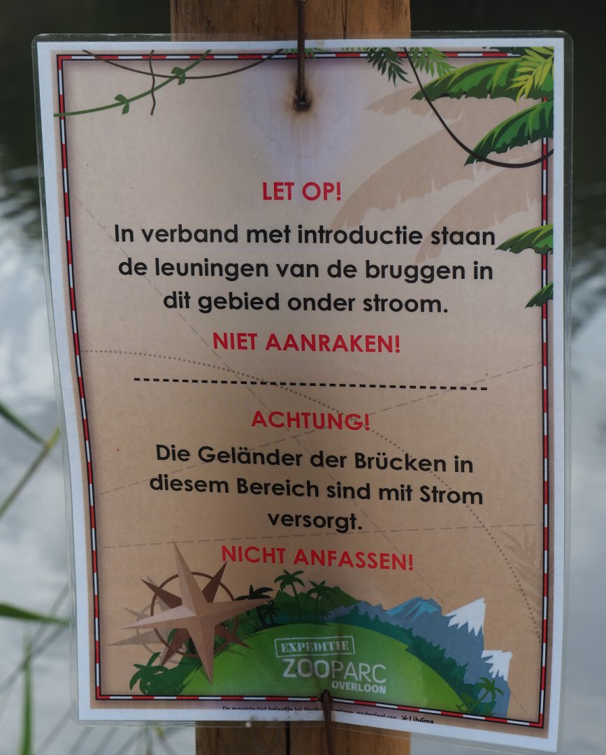 Sign Watch out - bridge is live because of animal introduction, do not touch, 2019-08-11
