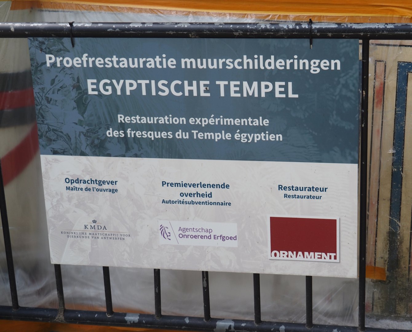 Signage about renovation trials for the murals of the Egyptian Temple, 2025-07-21