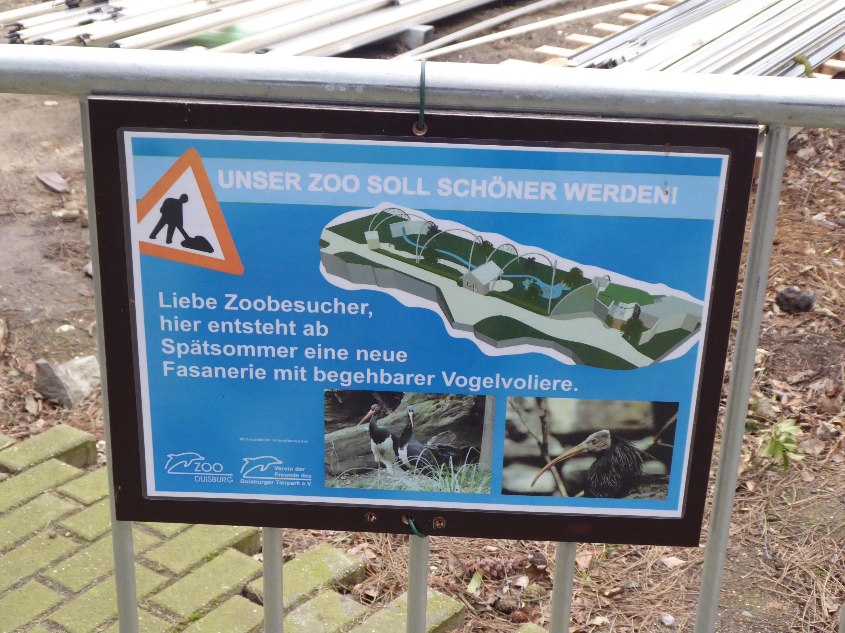 Signage discussing upcoming bird house development