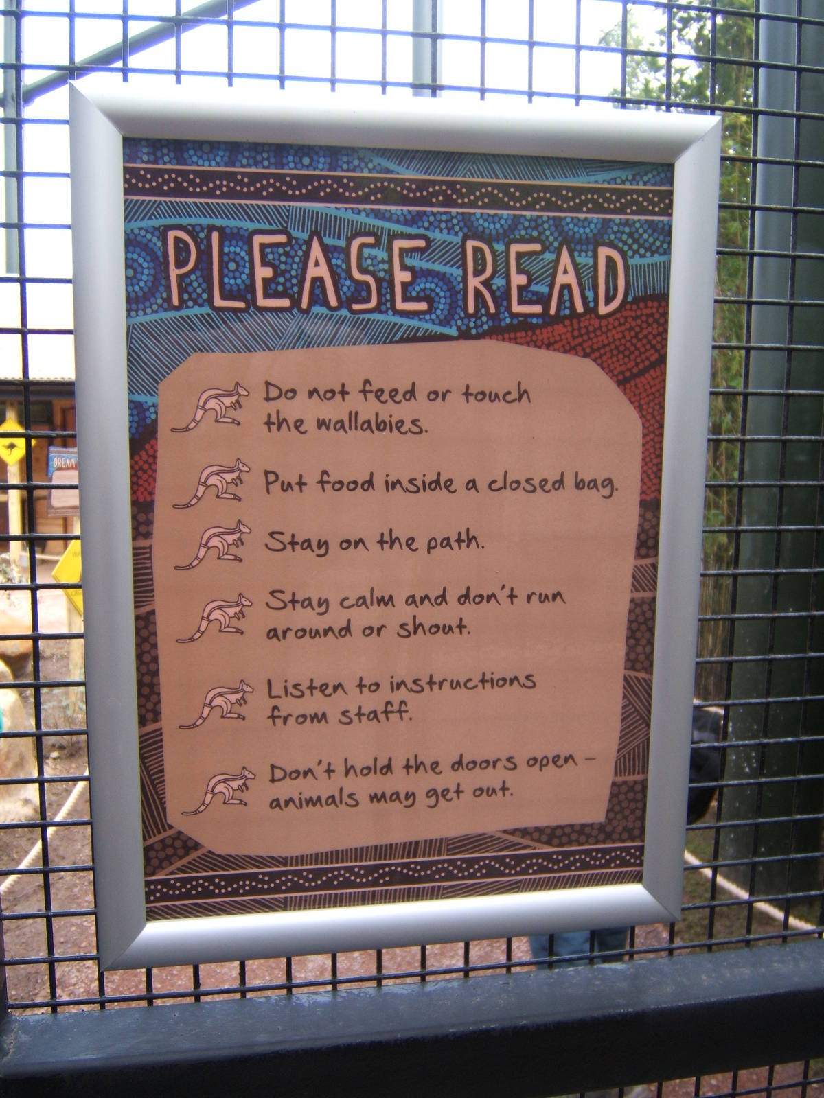 Signage on the entry doors to the Wallaby Walk through