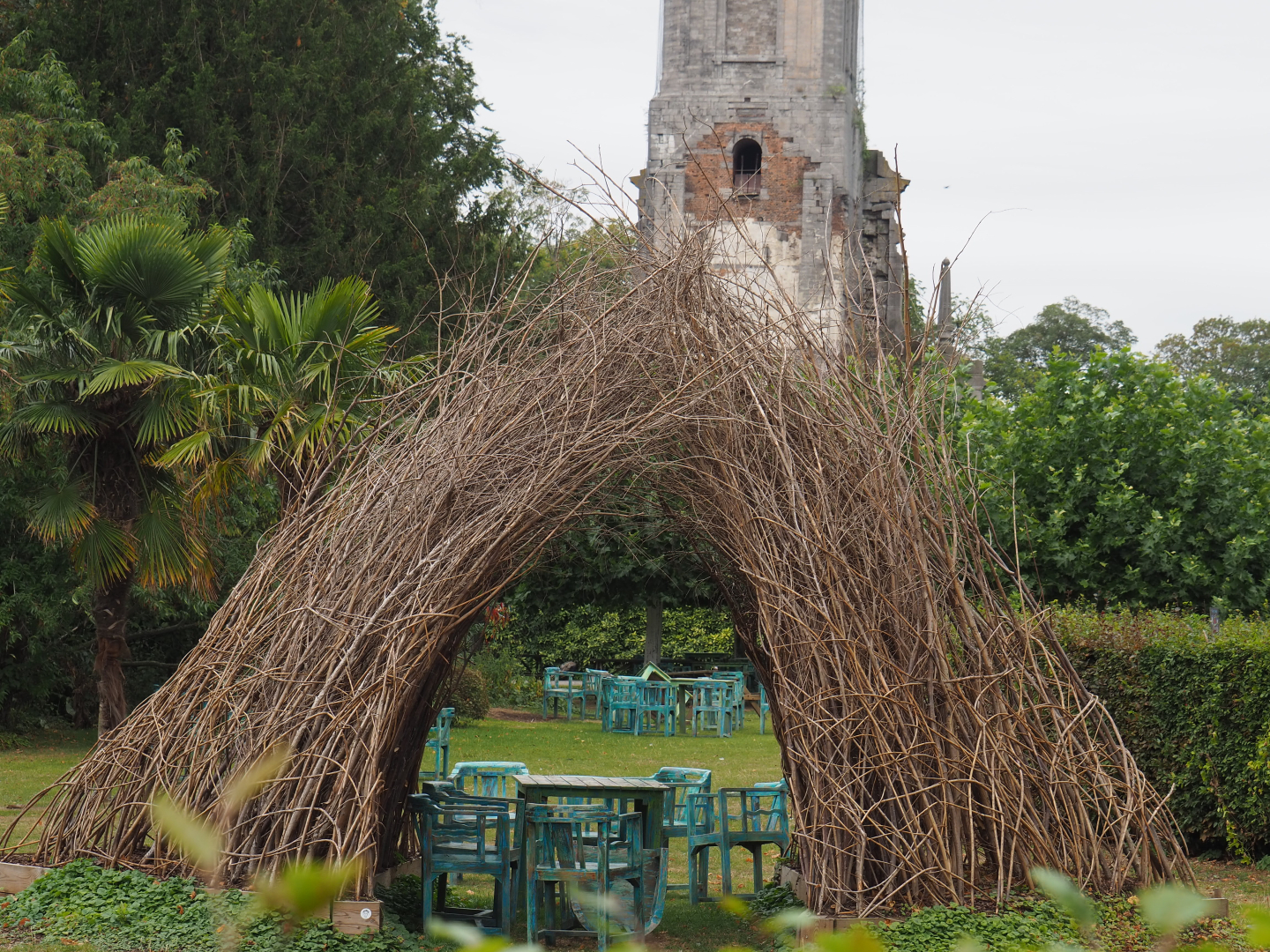 Sitting area with old chairs underneath bowerbird-inspired wicker structure, 2020-09-03