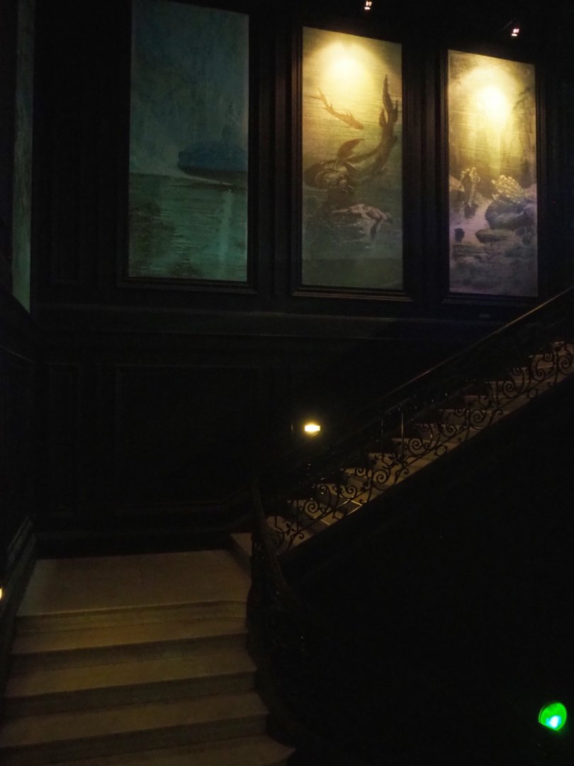 Staircase and paintings in 1852 castle serving as aquarium building, 2020-09-03