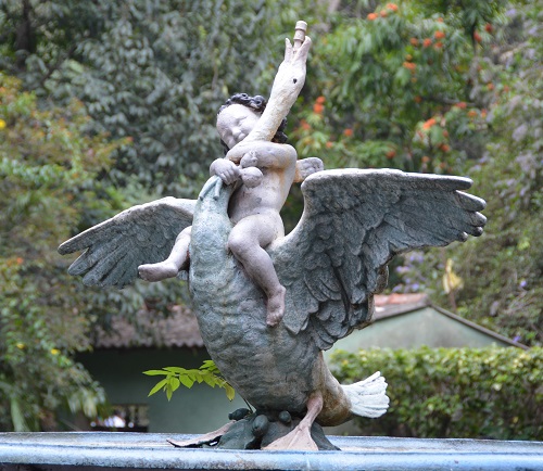 Statue.  Boy stangling a swan??