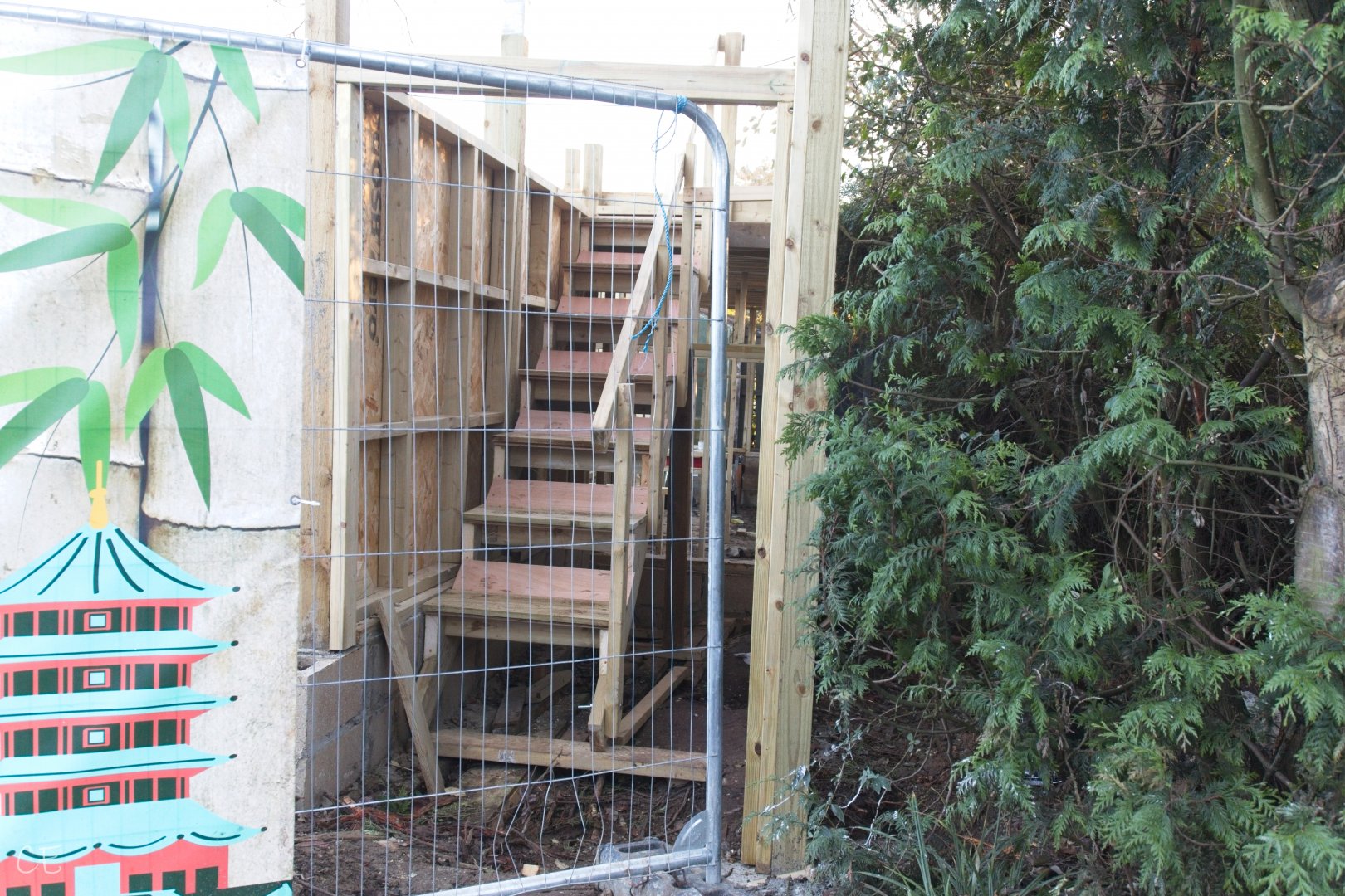 Steps to upper level. (New enclosure)