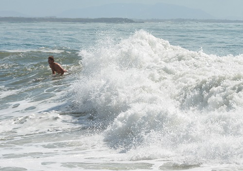 Surfing at Blackhead beach.