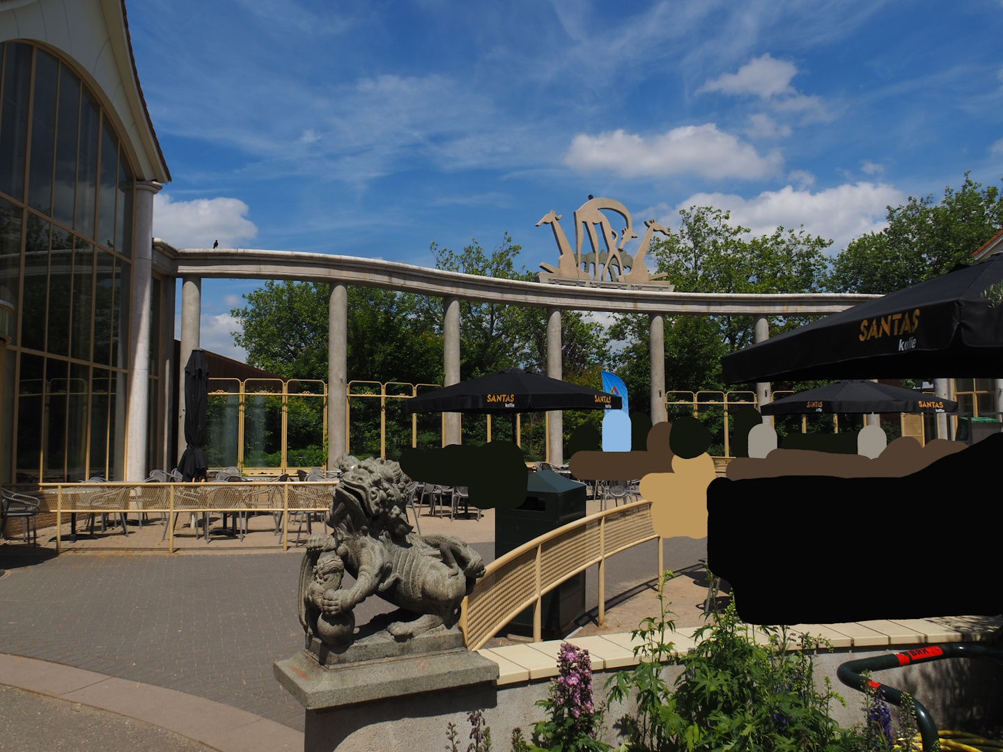 Terrace area and archway with giraffe statues between "Gate of Asia" restaurant and the Asiatic lion house, 2024-06-30