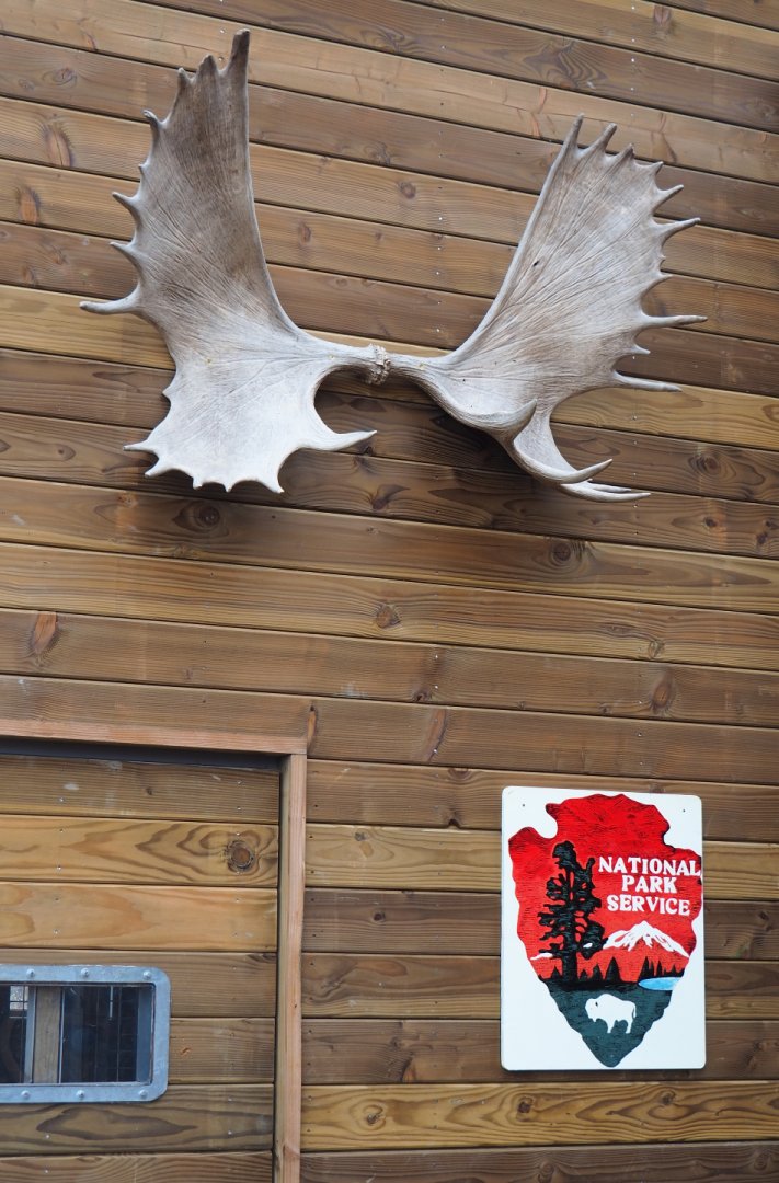 The Last Frontier theming items - Moose antlers and National Park Service sign, 2019-10-04