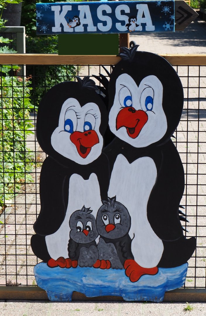 Towards the ticket counter sign with cartoon penguins, 2019-06-01