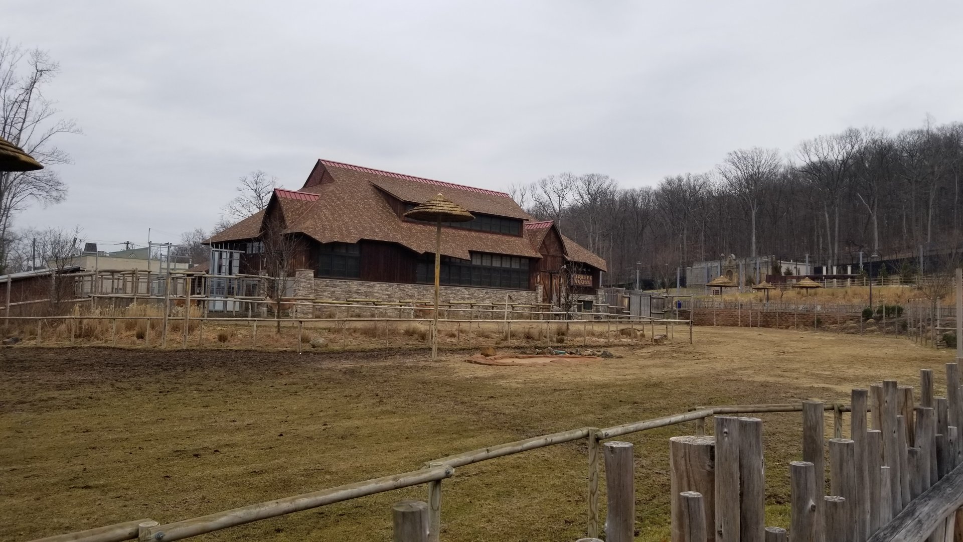 Turtle Back Zoo - Giraffe house, with lion exhibit in background
