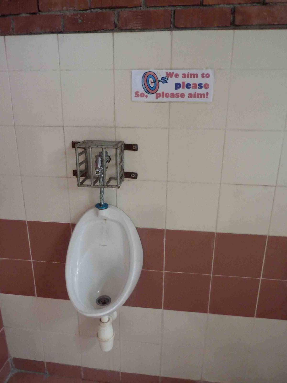 Urinal (where men pee) + sign, May 2013.