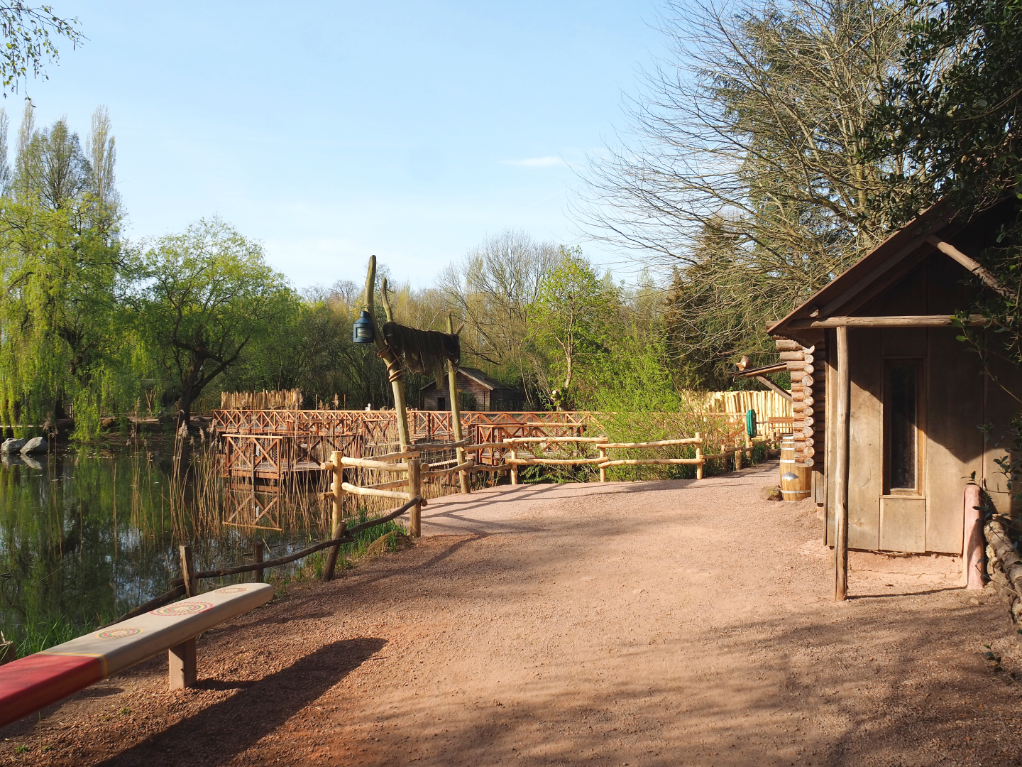View in the Australian area, showing partially renovated small animal house on the left and new walkway on the right, 2022-04-12
