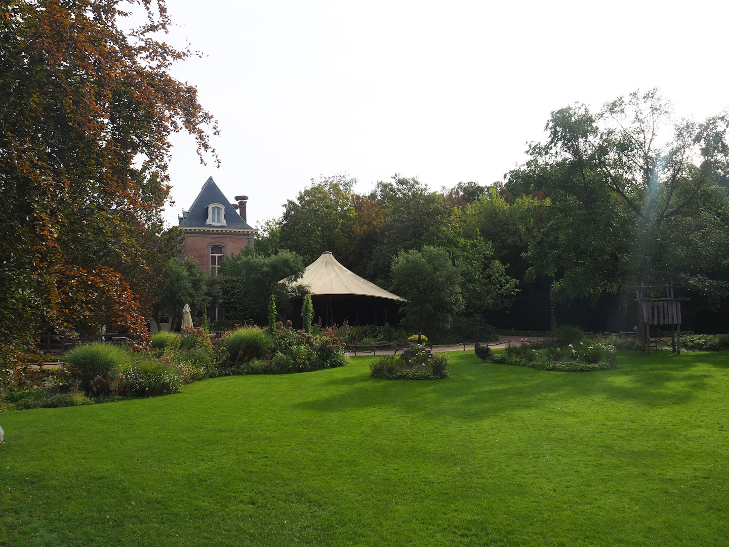 View of lawn and gardens in front of 1780 manor house, from seating for raptor show, 2023-09-19