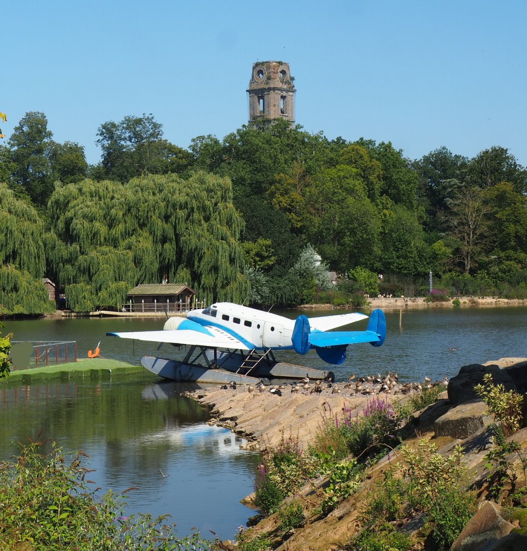 View onto lake with  Beechcraft Model 18 floatplane and old Cambron Abbey tower in the background, 2021-09-03