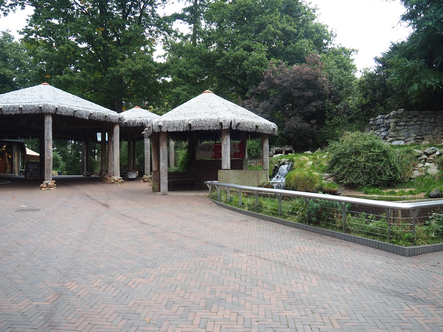 Walkway near entrance with penguin viewing areas and shelter, 2023-10-07