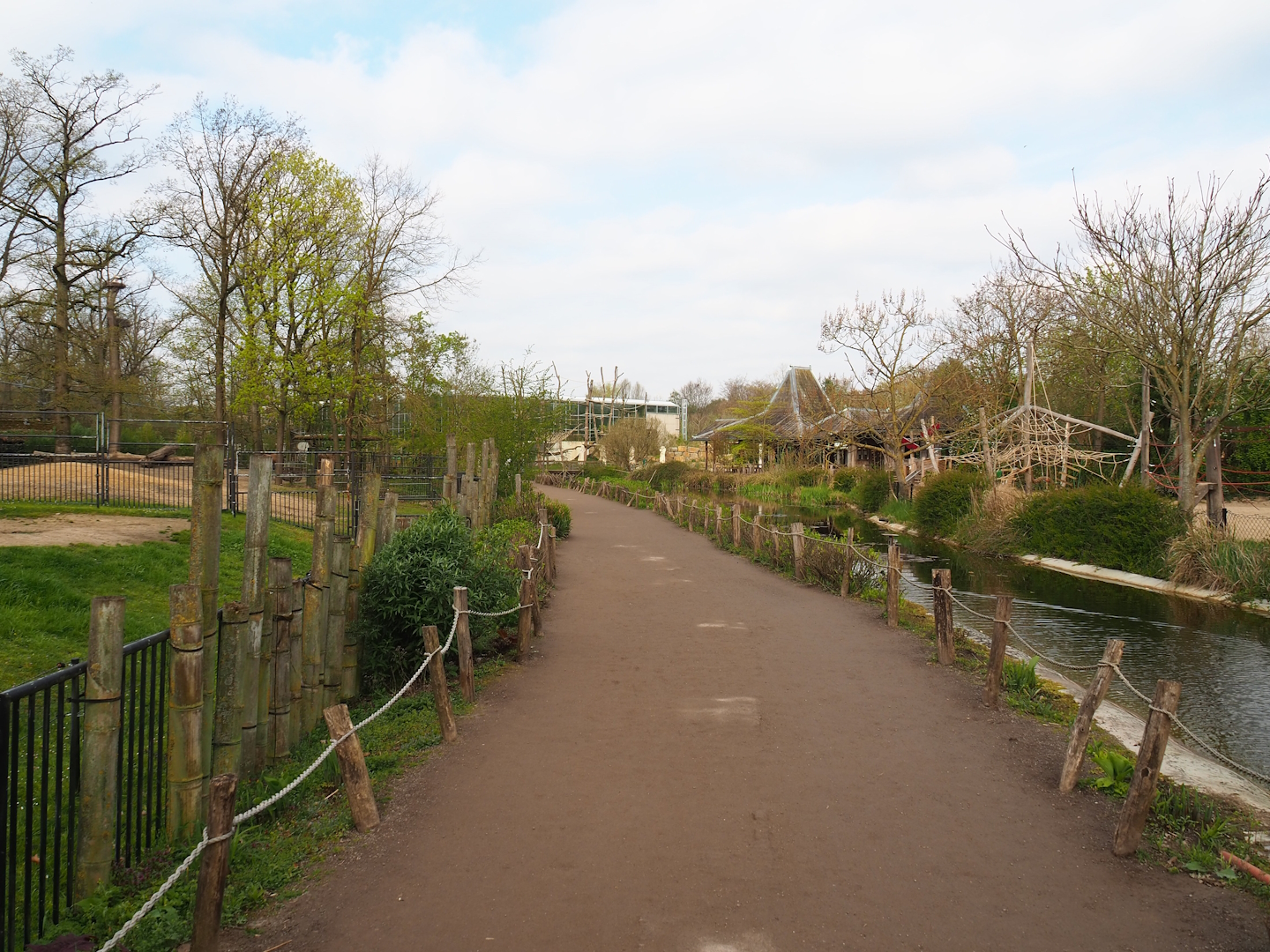 Walkway to main restaurant and orangutan greenhouse next to Bactrian camel and Wisent paddocks, 2023-04-18