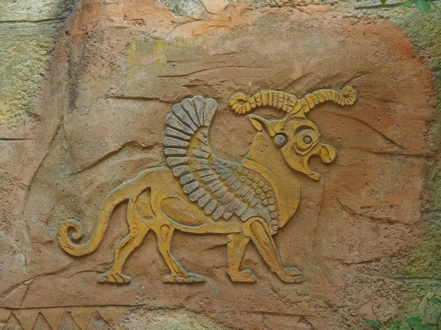 Weird mythological creature wall relief
