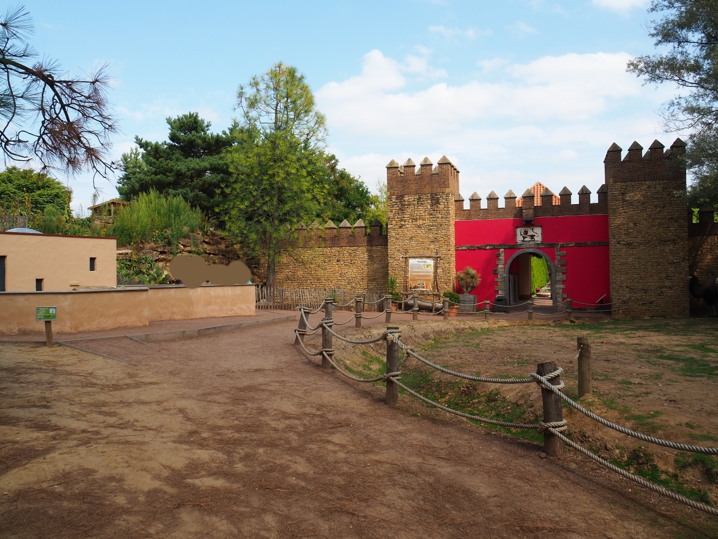 With the tufted capuchin exhibit and the leopard exhibit on top of the hill.
