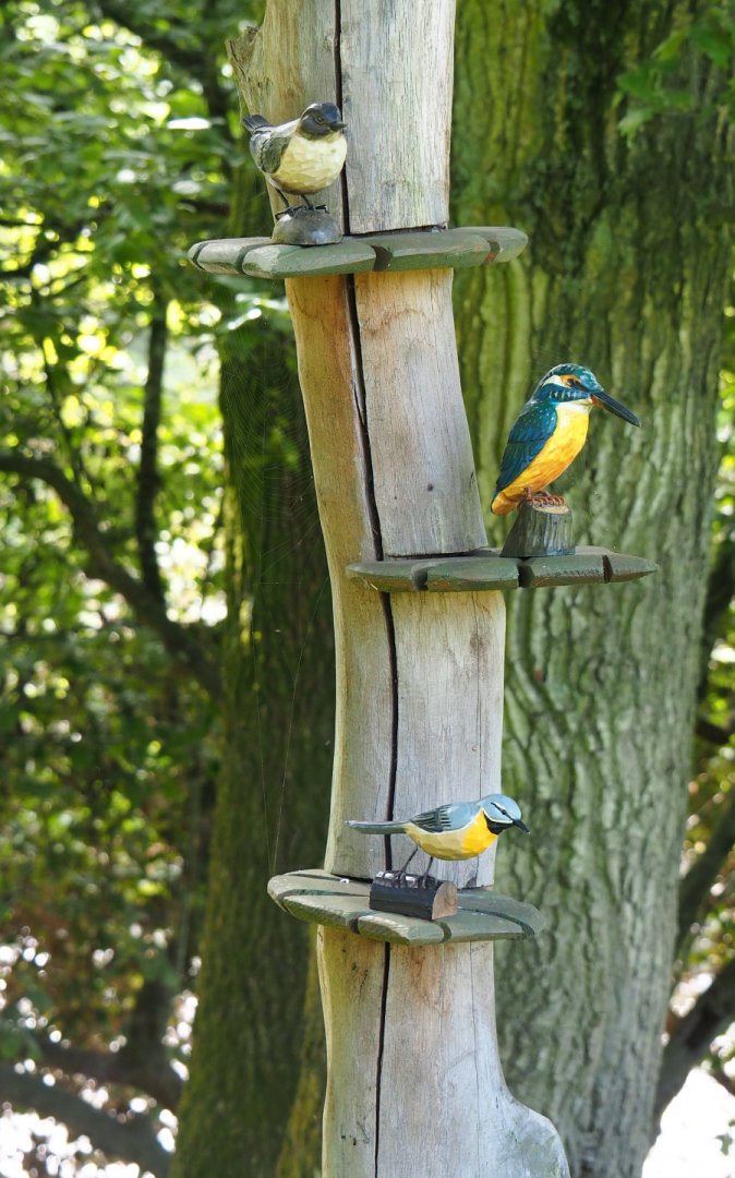 Wood carvings of small bird species associated with flowing creeks, 2021-08-15