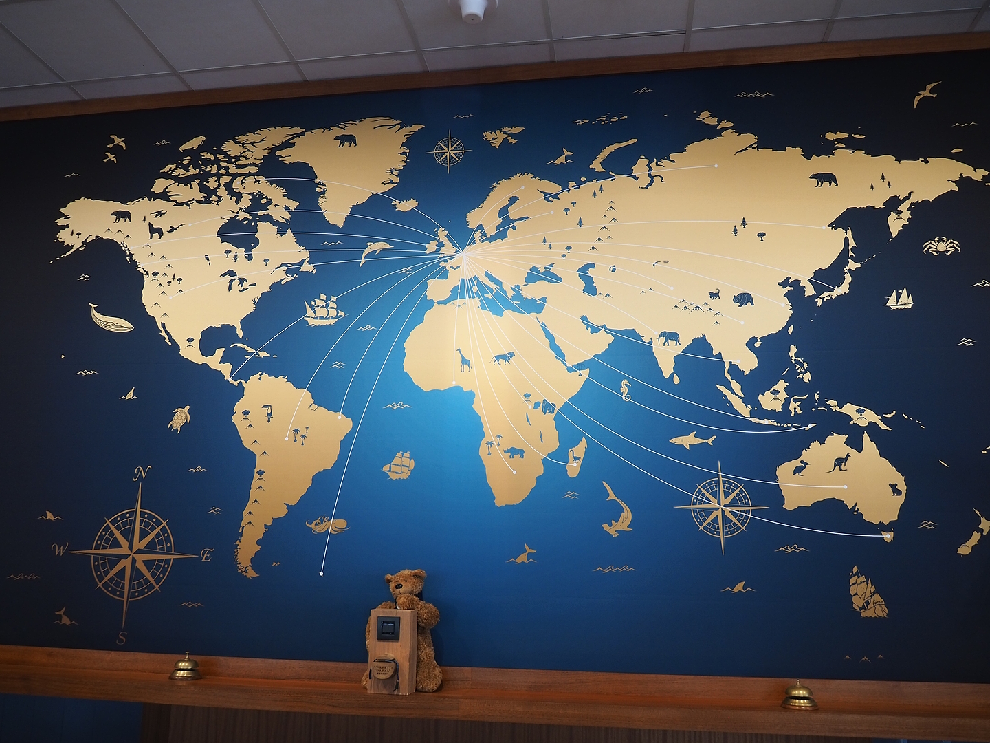 World map behind the resort reception desk, 2023-05-16