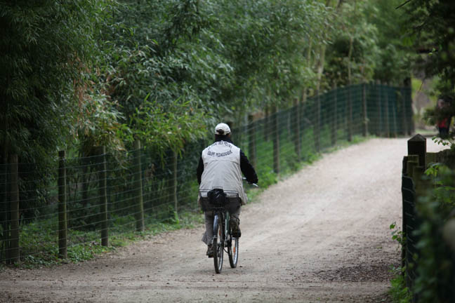 zoo worker on bicycle